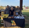 Jeremiah Terrel and Karen Funkenbusch standing behind a display table.